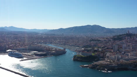 Flying-towards-Marseille-Vieux-Port-aerial-shot-sunny-day-large-view-boats